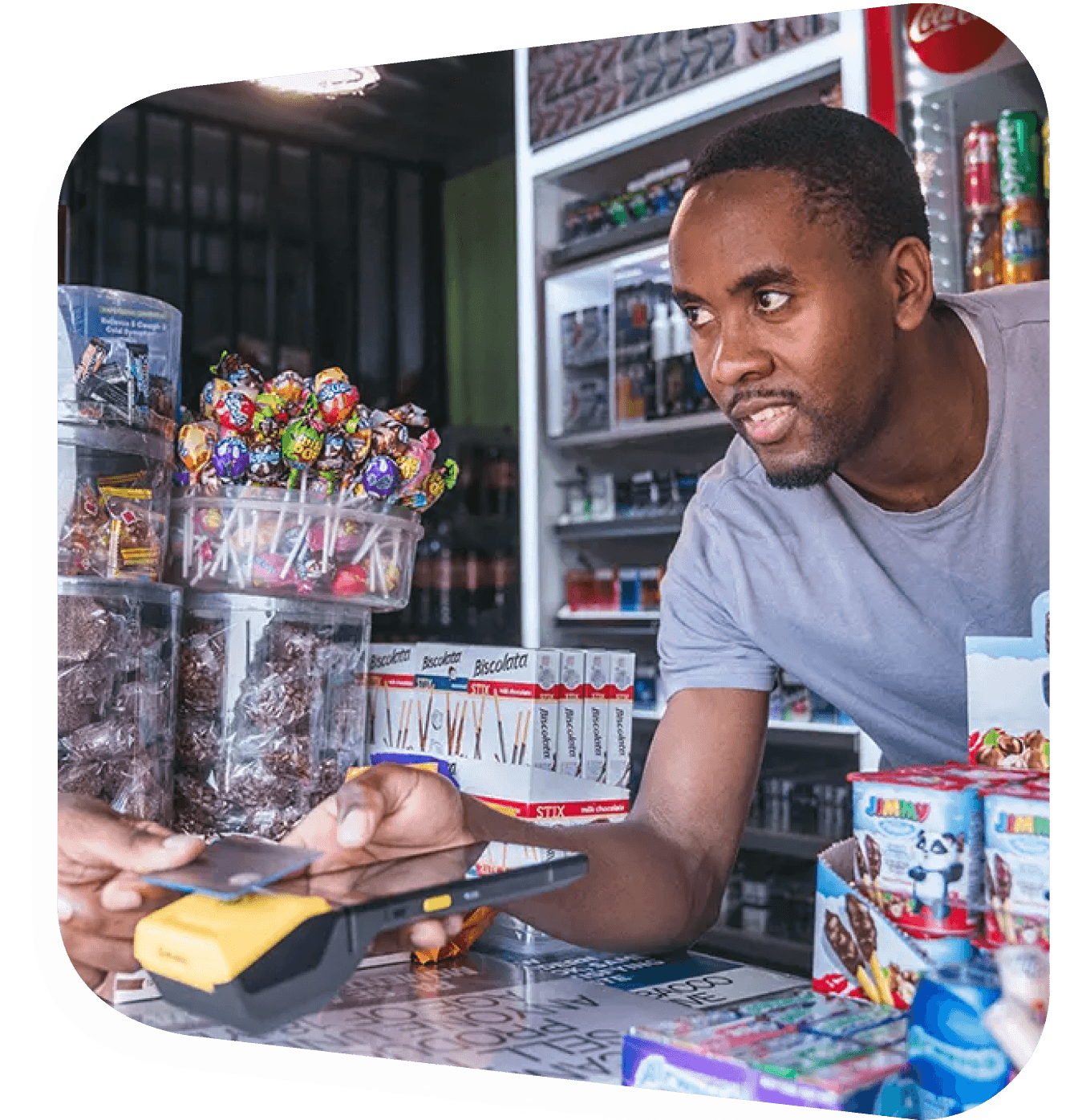 man selling in tuck shop